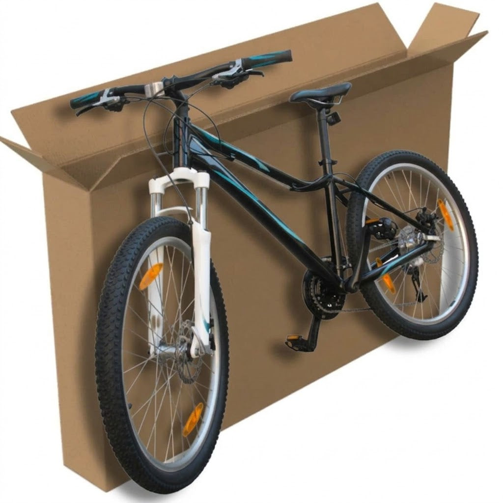 Bicycle inside a cardboard moving box on a white background
